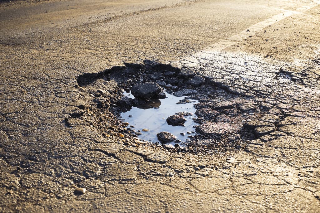 pothole damaged car